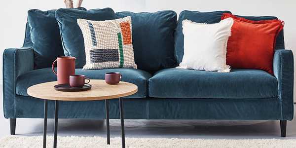 The blue Habitat Swift 3-seater velvet sofa in a modern lounge setting.